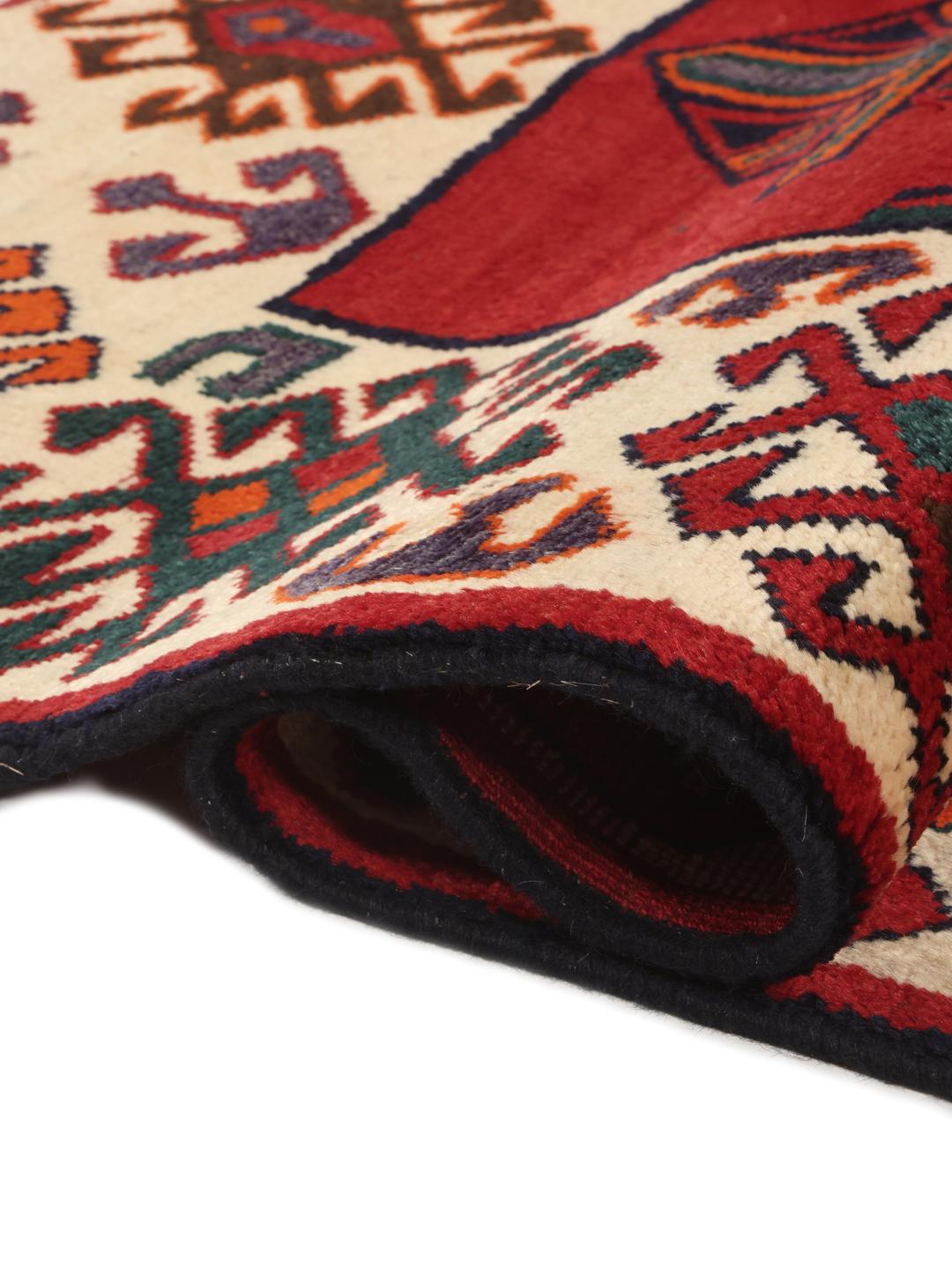 Hand-knotted Lori rug from the Middle East with a red and dark-blue geometric design.