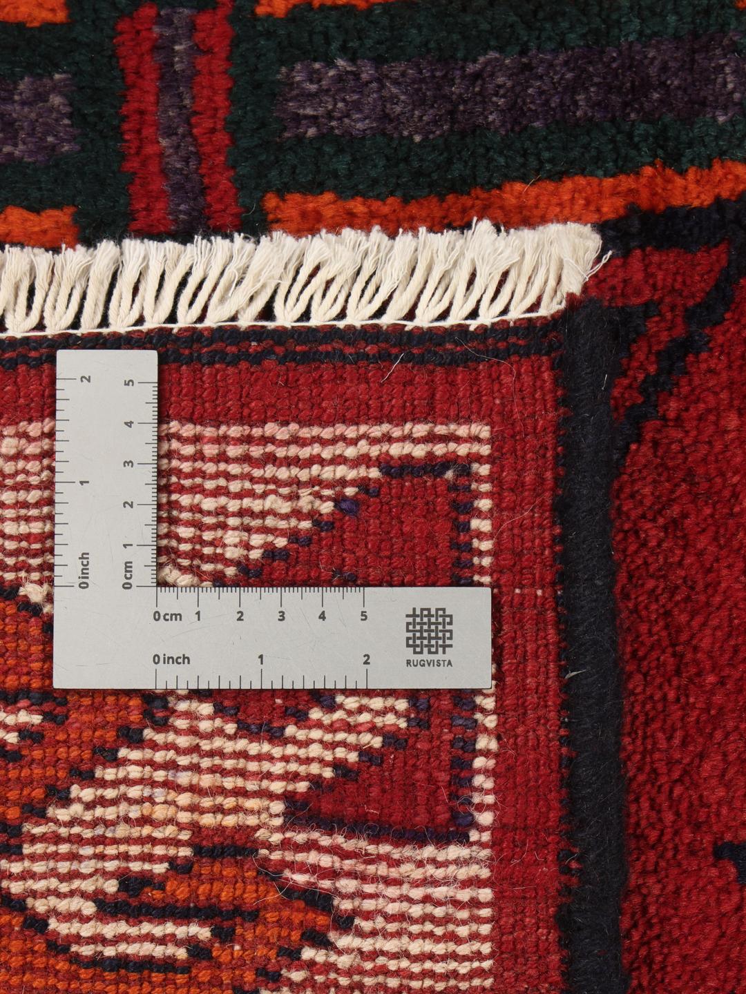 Hand-knotted Lori rug from the Middle East with a red and dark-blue geometric design.