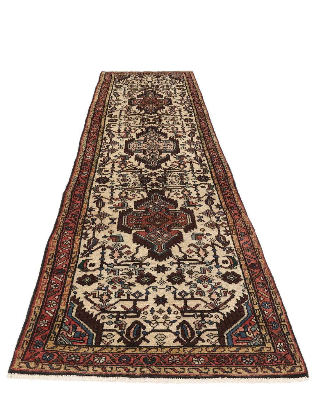 Handgeknoopte loper uit het Midden-Oosten met geometrische motieven in beige en donkerrode tinten