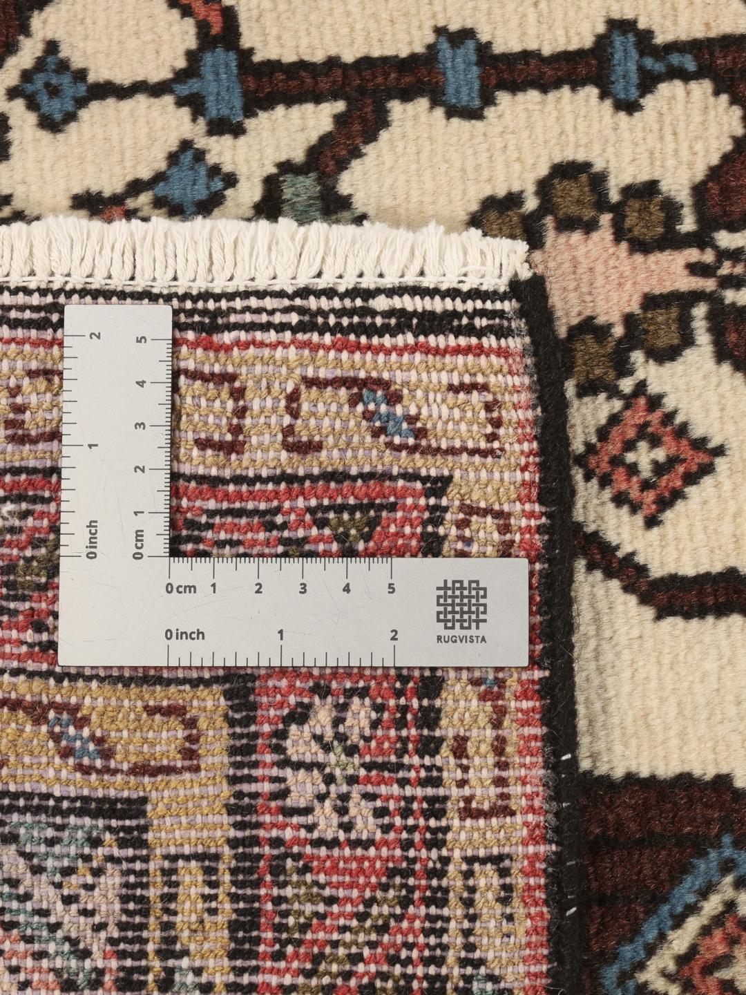 Handgeknoopte loper uit het Midden-Oosten met geometrische motieven in beige en donkerrode tinten