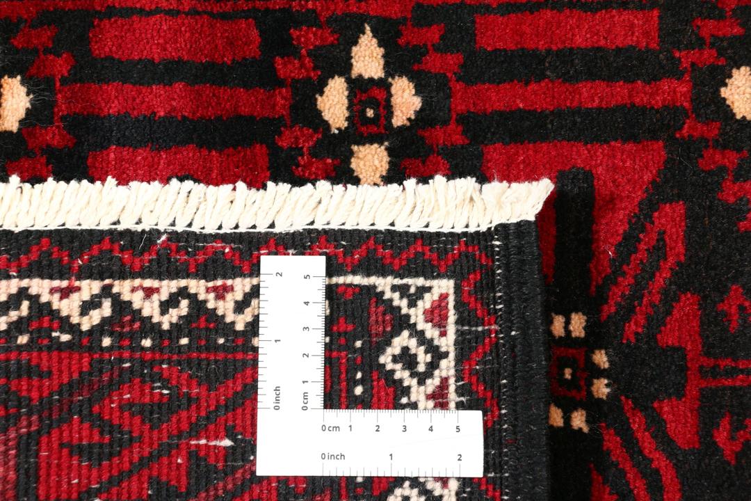 Handgeknoopt Kurdi-tapijt uit het Midden-Oosten in donkerrode en zwarte tinten.