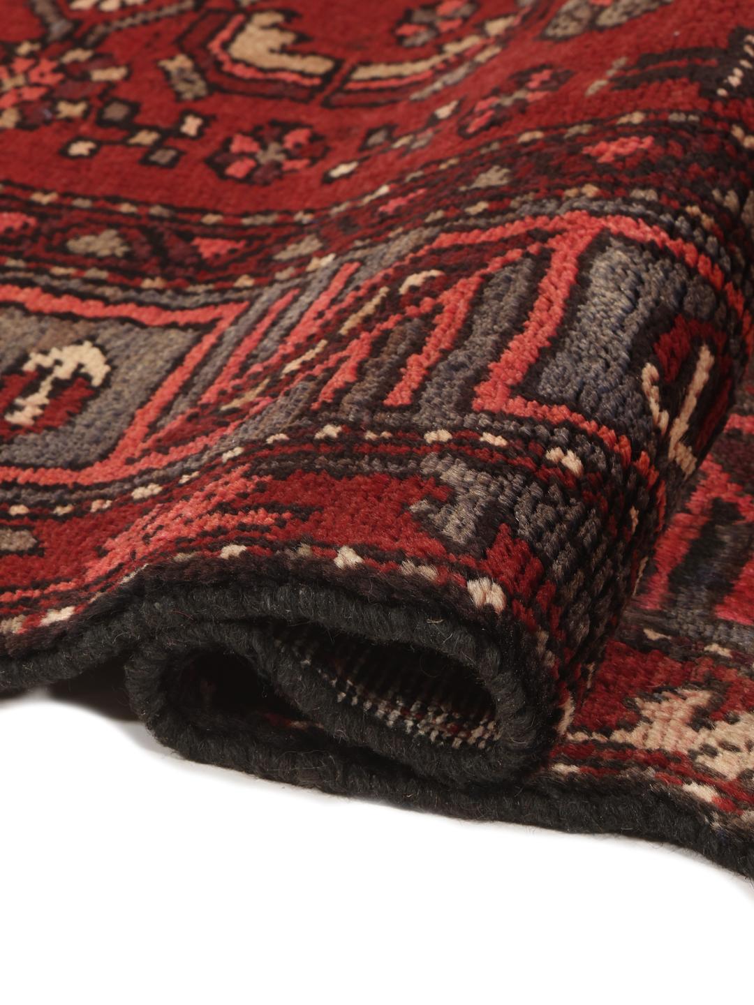 Handgeknoopt Zanjan-tapijt uit het Midden-Oosten in donkerrood met geometrische patronen