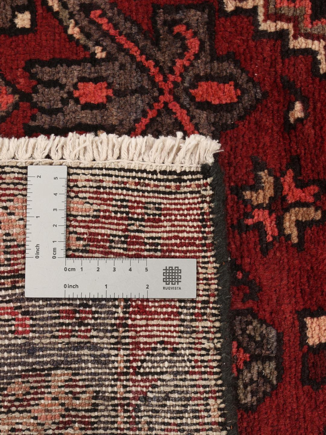 Handgeknoopt Zanjan-tapijt uit het Midden-Oosten in donkerrood met geometrische patronen