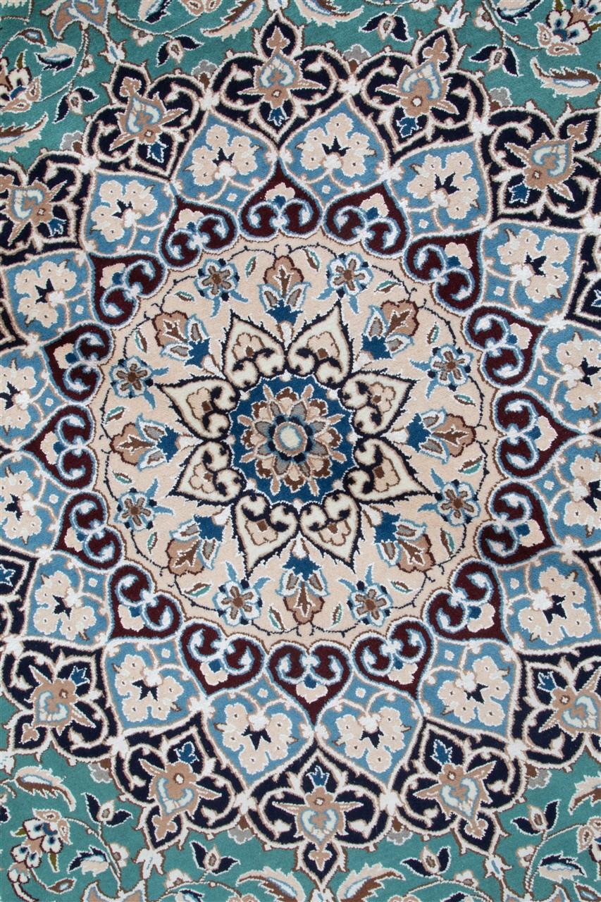 Rundt tæppe fra Persia i blågrøn farve