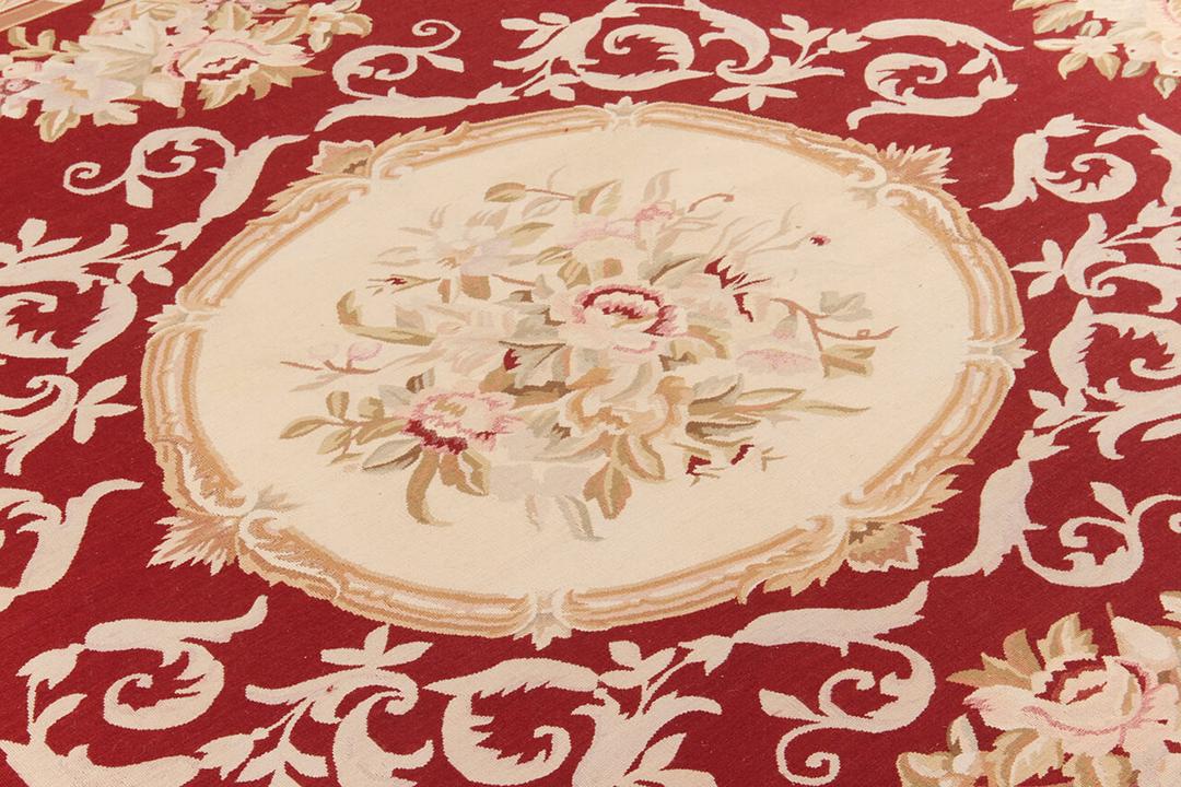 Hand-woven Aubusson-style kilim rug from China with a red and beige floral medallion design