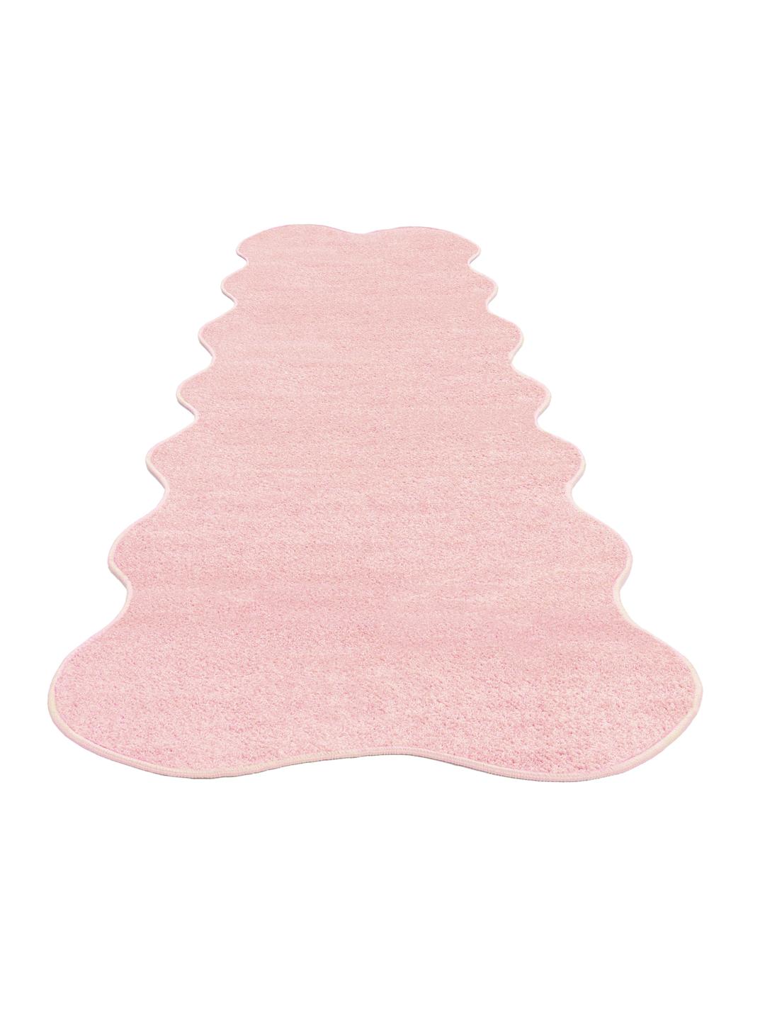 Roze vloerkleed met een onregelmatige golvende vorm