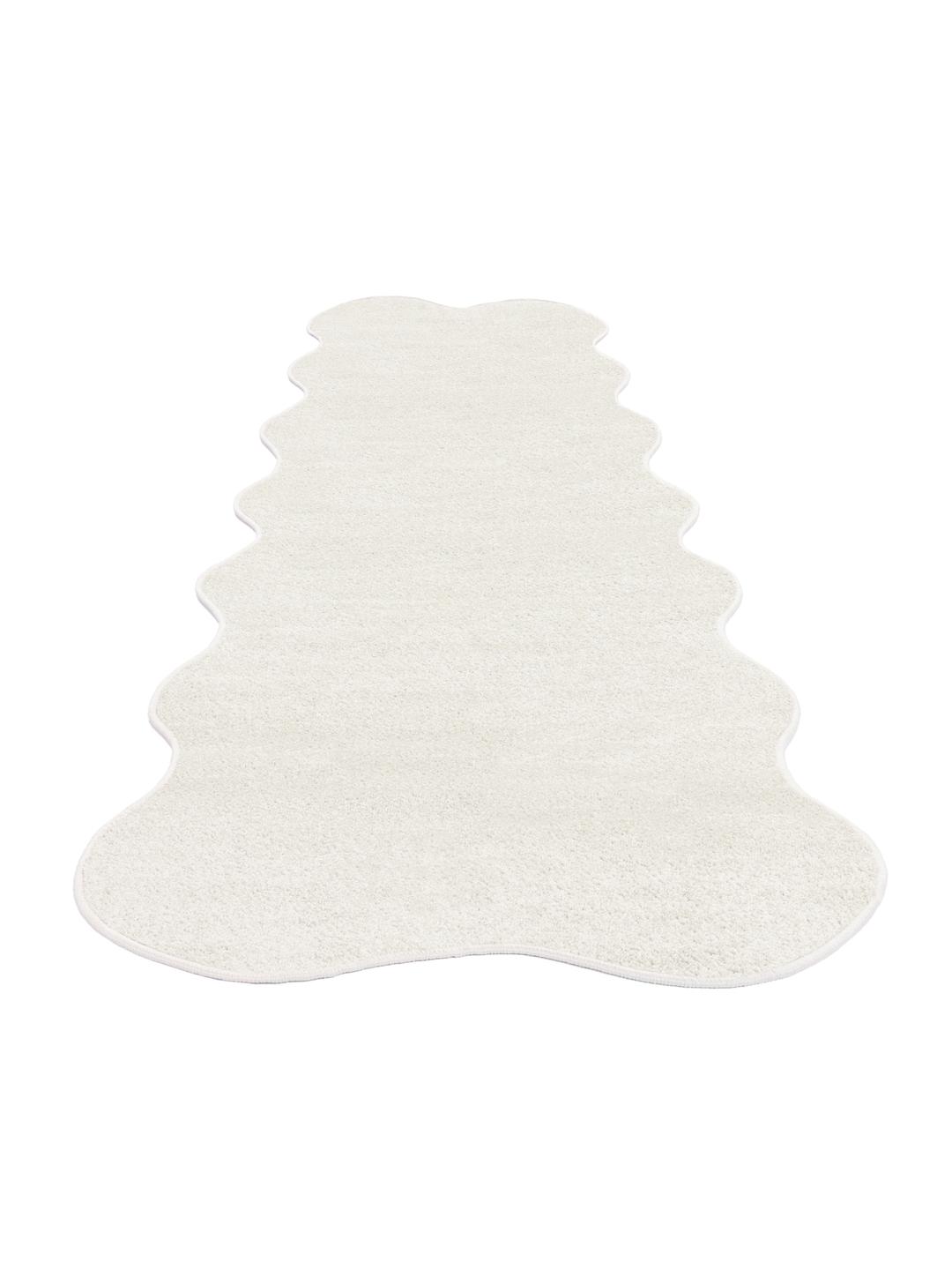 Tapis blanc de forme irrégulière et ondulée