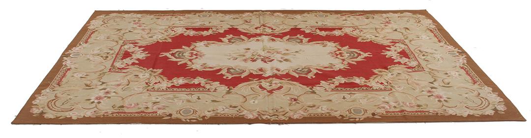 Håndvævet blomstret kilim-tæppe fra Kina i røde og beige toner