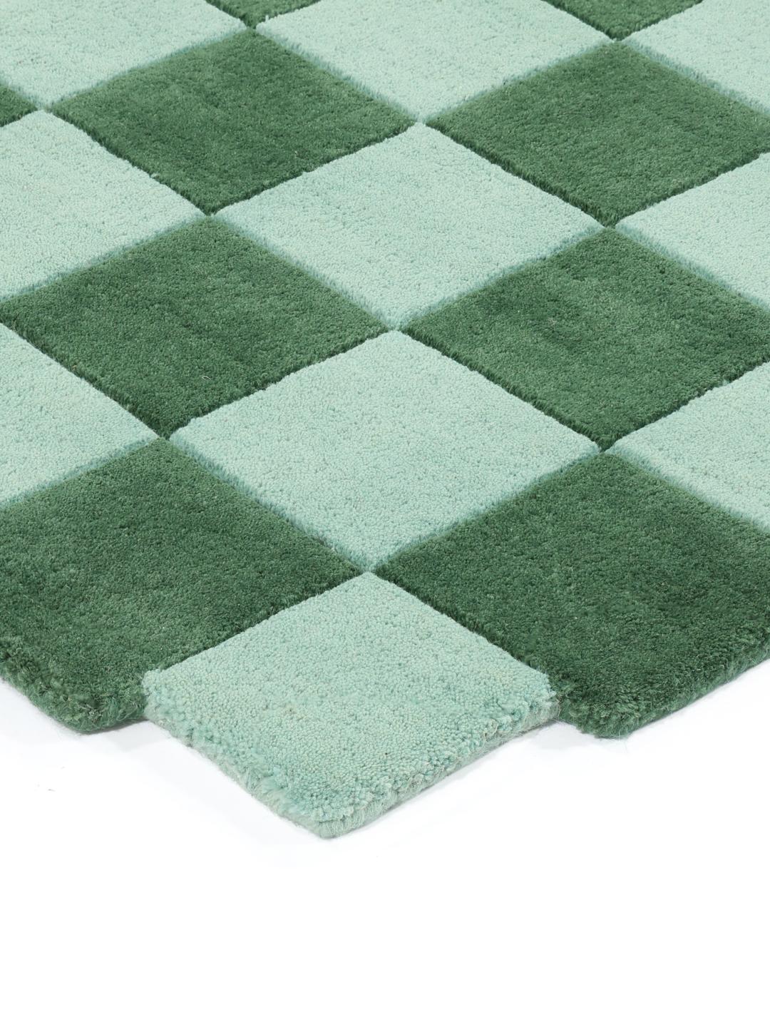 Groene en mintgroene geruite deurmat