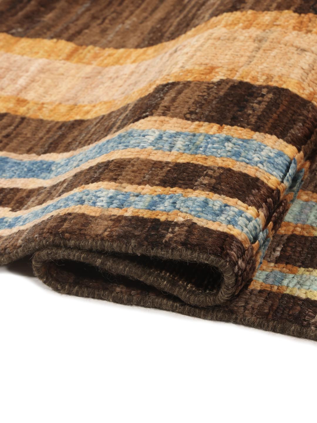 A vibrant, multicoloured, hand-knotted Afghan rug featuring a geometric block pattern.