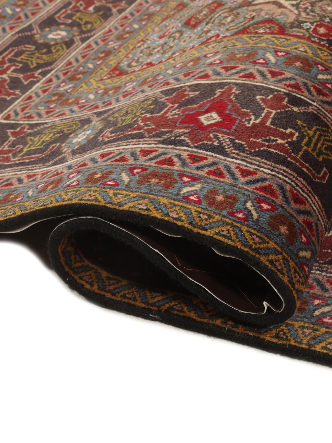Hand-knotted Tabriz rug from the Middle East in deep red and blue tones