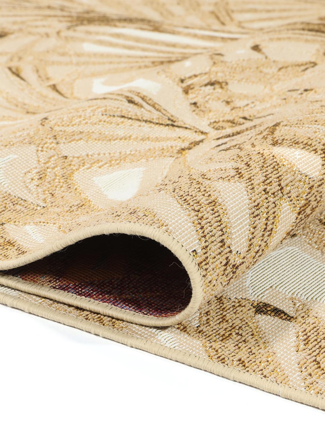 Tapis jaune et blanc avec motif de feuilles