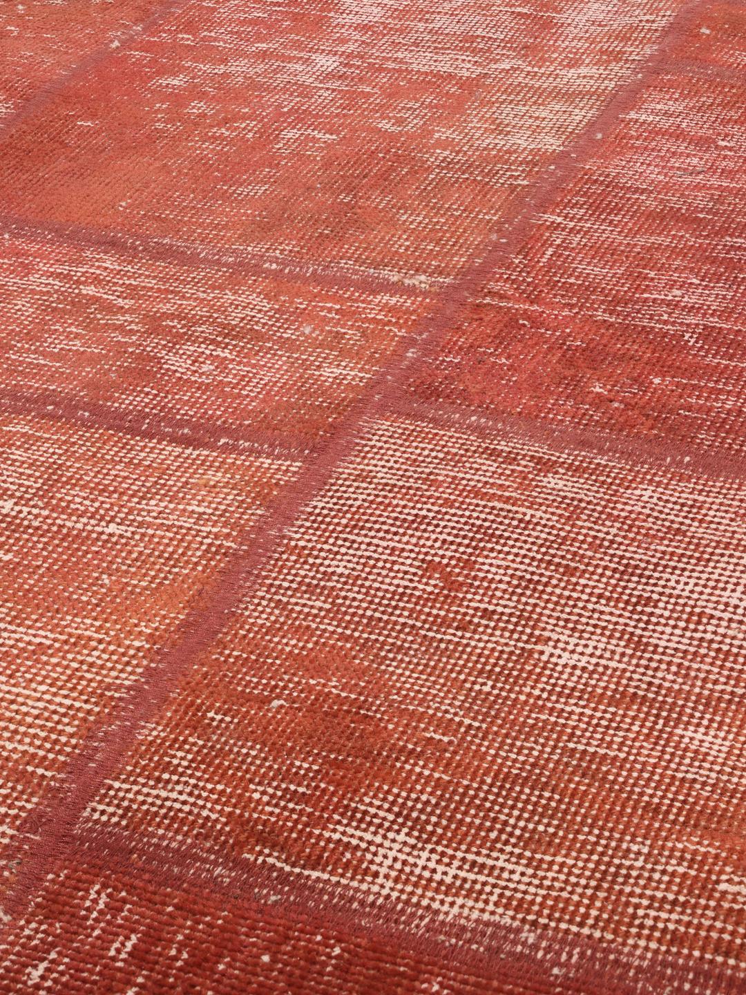 Patchwork rug from the Middle East in red tones