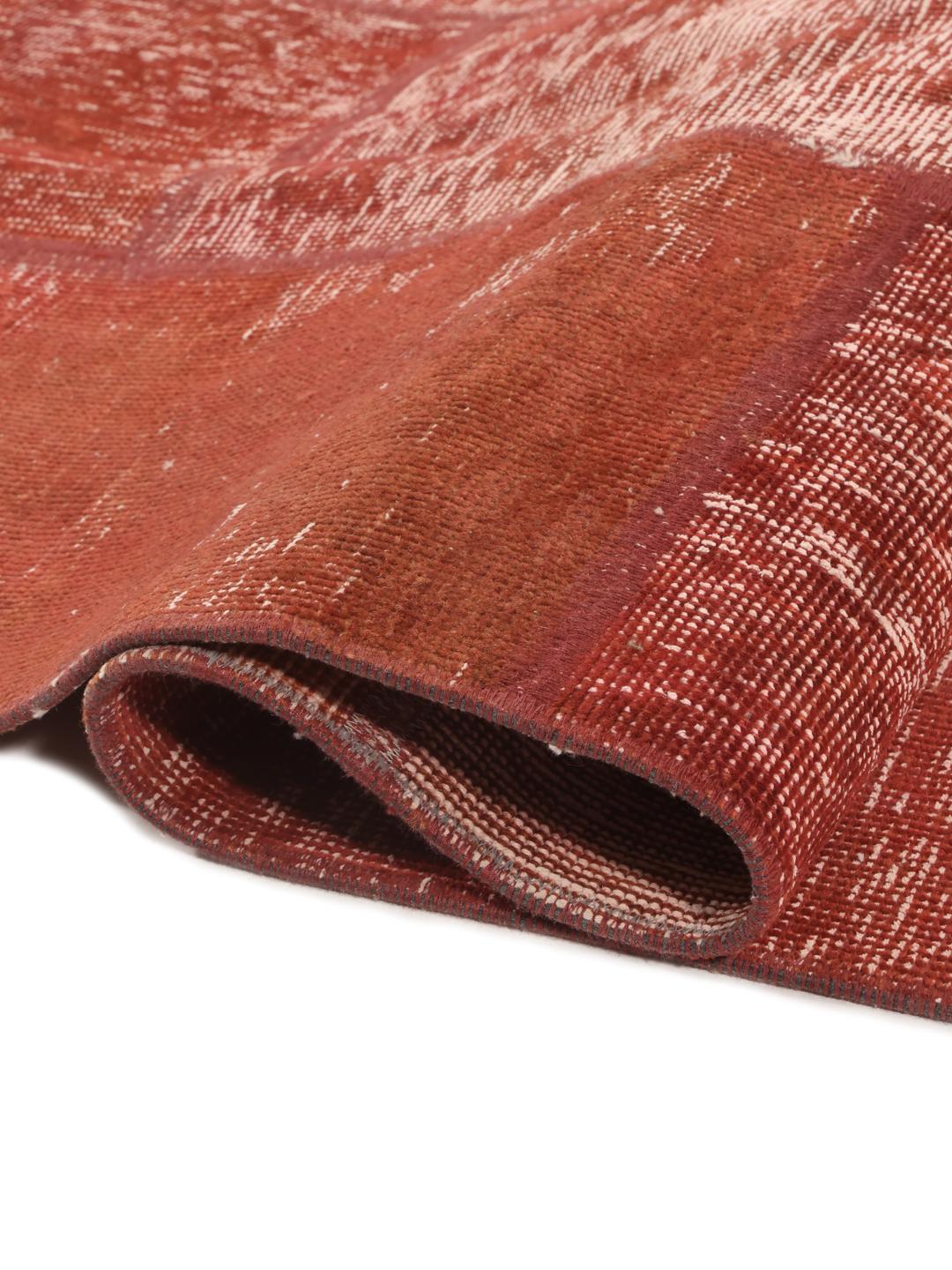 Patchwork rug from the Middle East in red tones