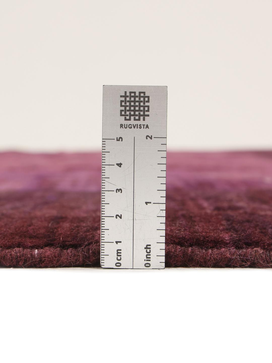 A hand-knotted Gabbeh Fine rug from the Middle East in deep purple tones.