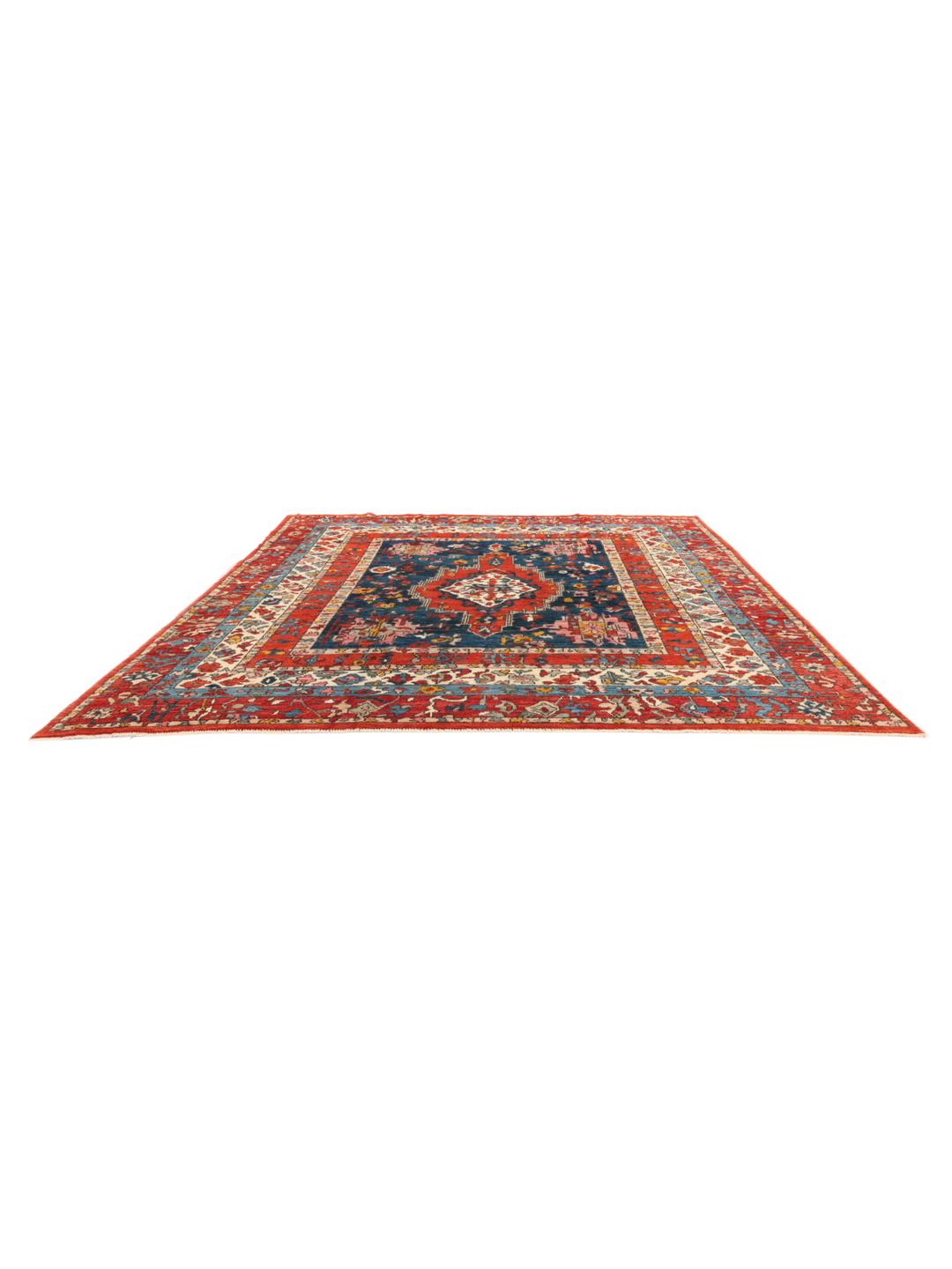 Tapis Kazak afghan noué à la main avec un design géométrique vibrant et des tons bleu et rouge.
