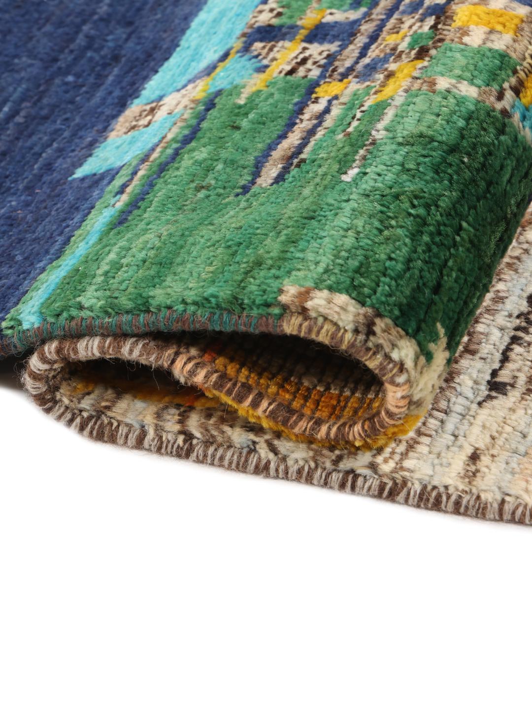 Tapis afghan noué à la main avec un design multicolore vibrant et artistique