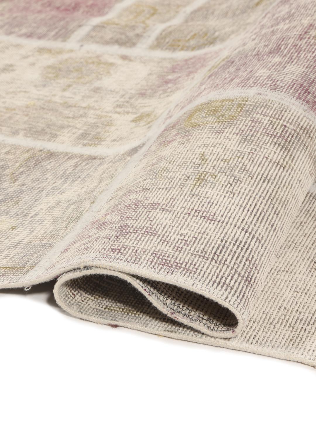 A rectangular handmade patchwork rug from the Middle East featuring a multicolor palette.