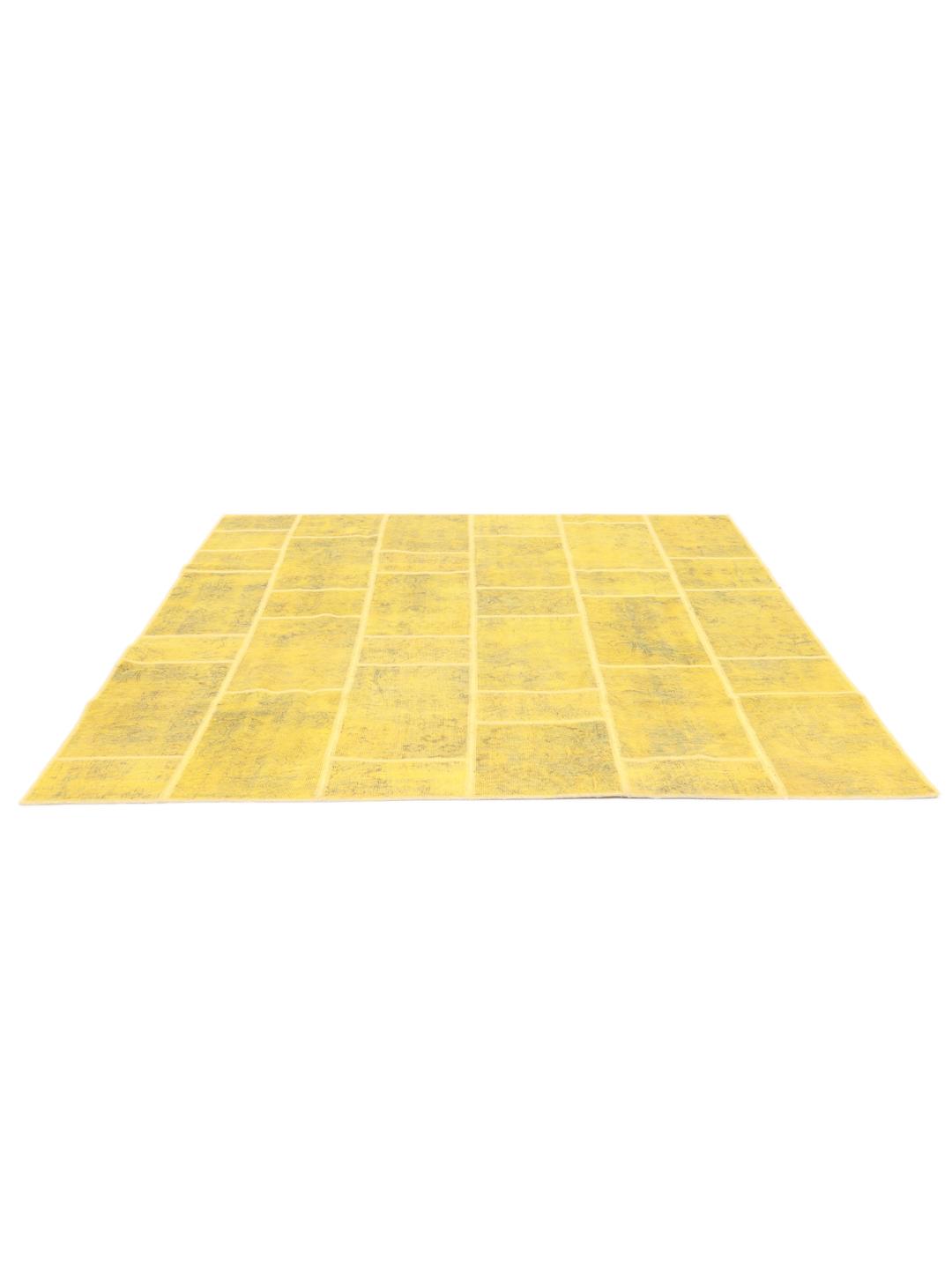 Hand-knotted patchwork rug from the Middle East in vibrant yellow