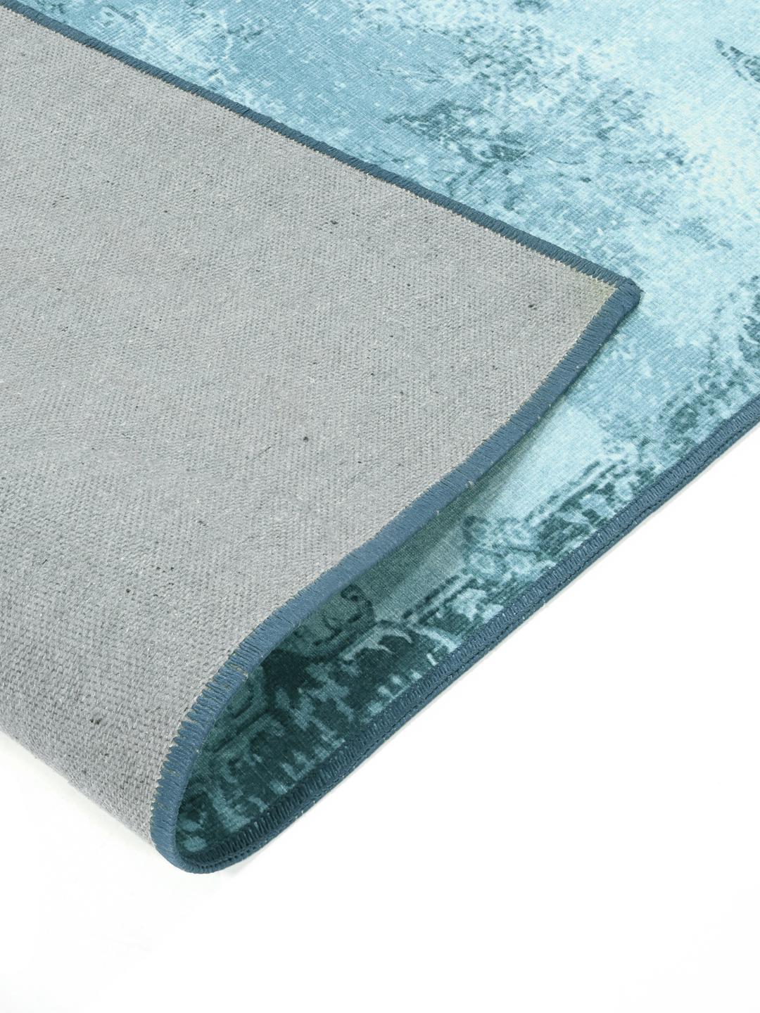 rechthoekig turquoise tapijt met geprint patroon