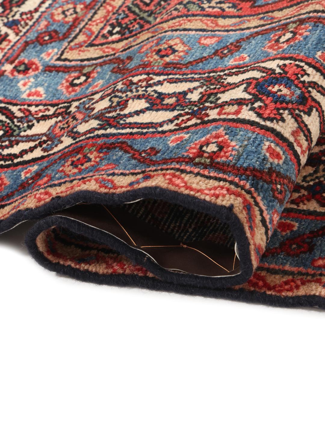 Met de hand geknoopt Hamadan-tapijt uit het Midden-Oosten met een rood medaillon en blauwe accenten