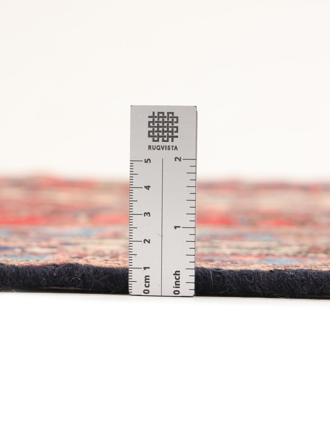 Met de hand geknoopt Hamadan-tapijt uit het Midden-Oosten met een rood medaillon en blauwe accenten