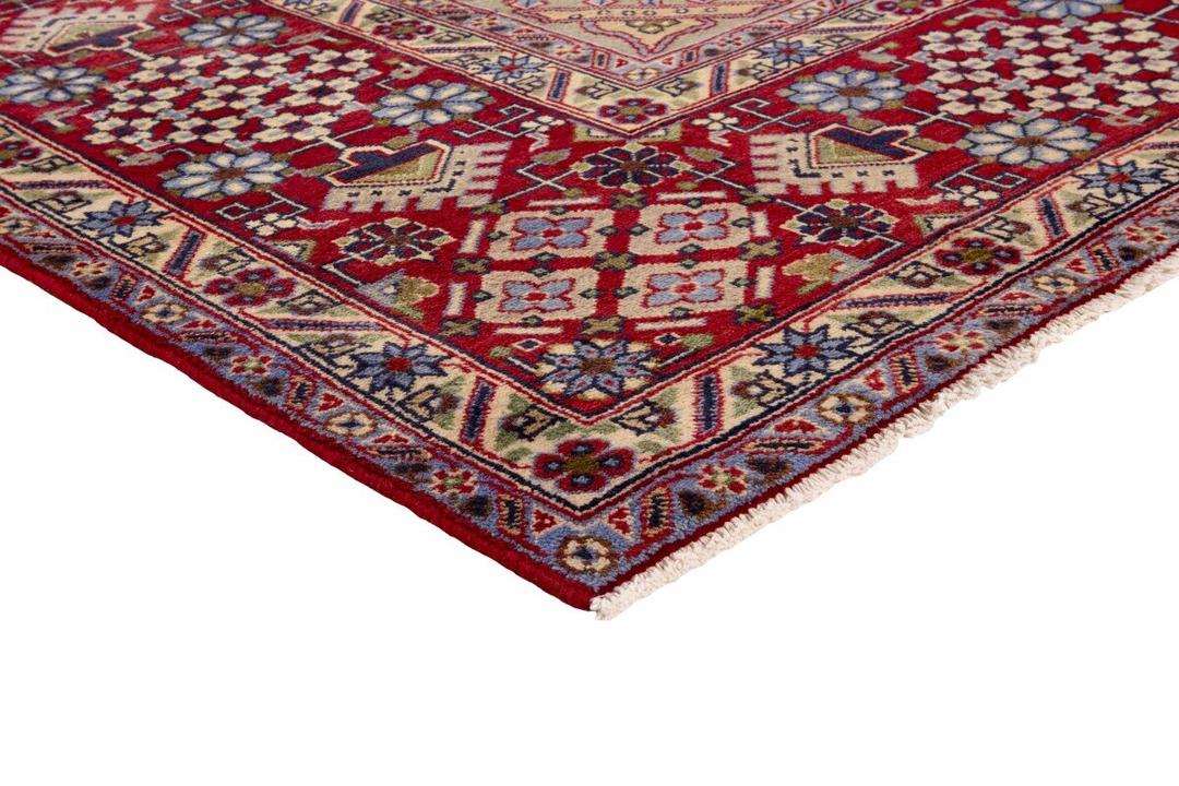Handgeknoopt Najafabad tapijt uit het Midden-Oosten met een levendig rood en blauw geometrisch patroon