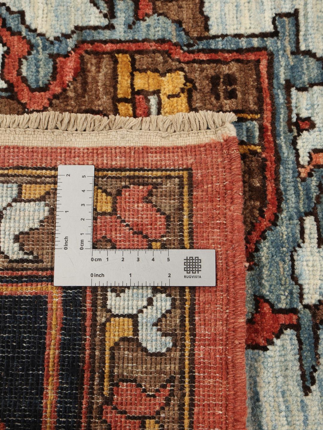 Ręcznie wiązany afgański dywan z ciemnoczerwonym tłem i tradycyjnym wzorem medalionu.