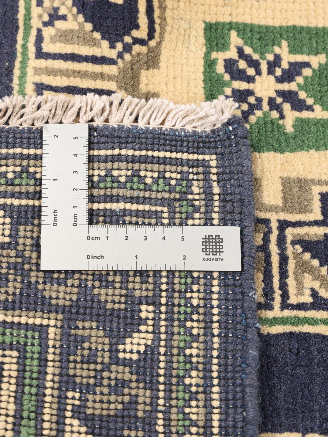 Met de hand geknoopt Afghan tapijt met een donkerblauw veld en geometrische patronen