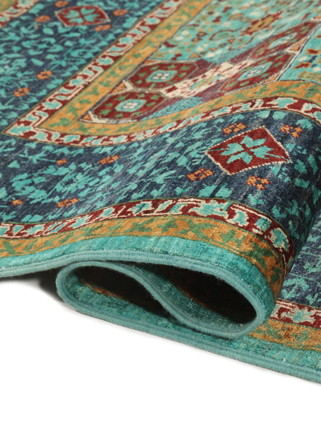 Handgeknoopt Mamluk-tapijt uit Afghanistan met een groenblauw veld en ingewikkelde geometrische patronen.