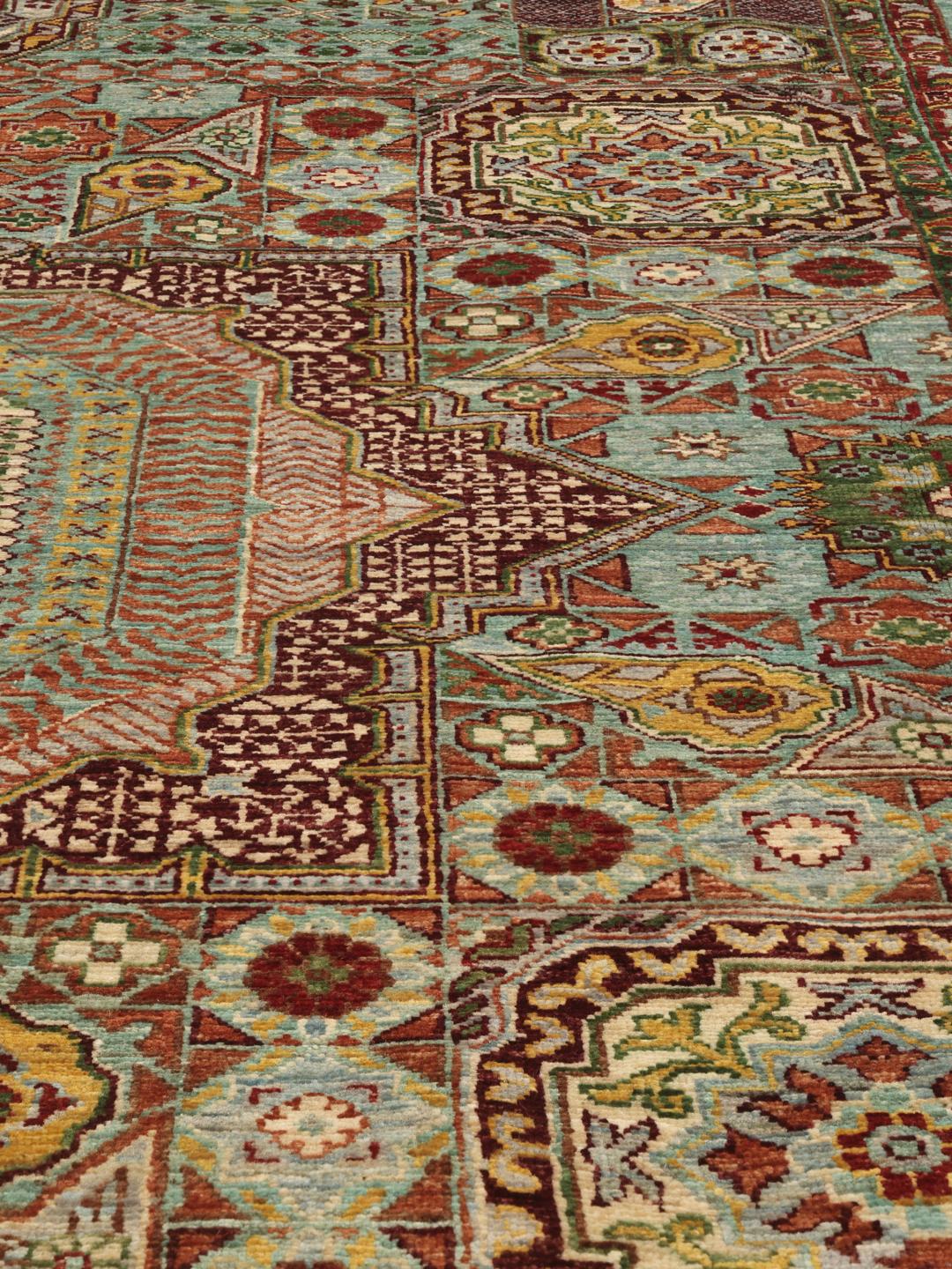 Handgeknoopt Afghaans Mamluk-tapijt met een geometrisch medaillonpatroon in lichtblauwe en warme aardetinten.