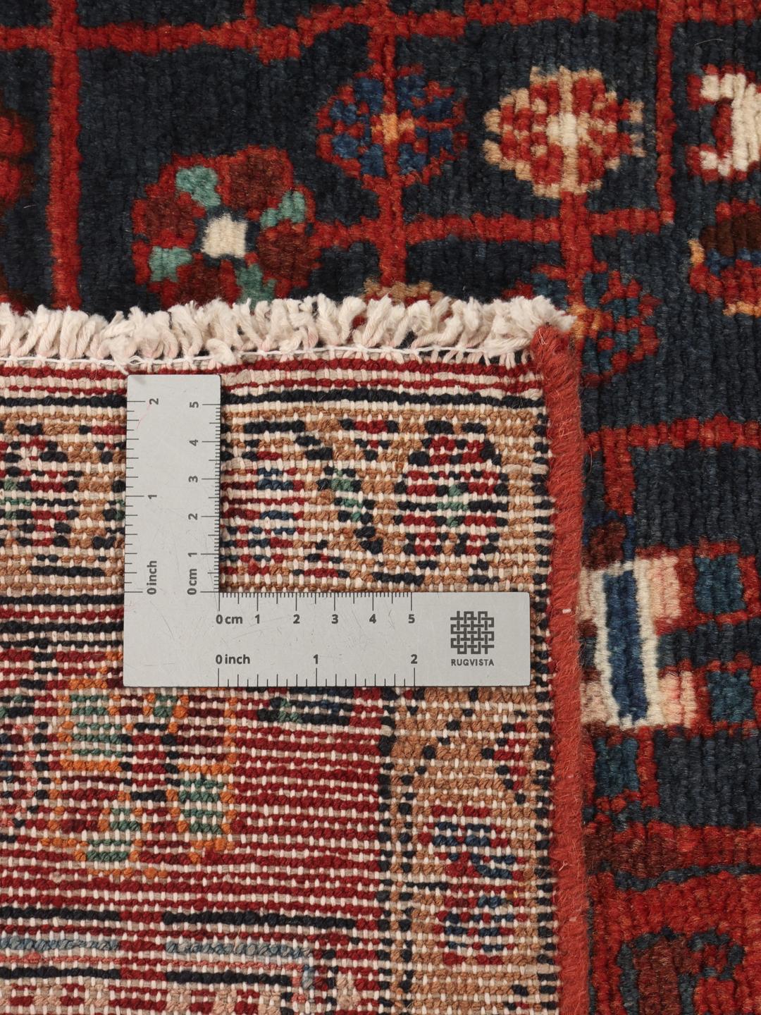 Handgeknoopt Nahavand-tapijt uit het Midden-Oosten in donkerrood en blauw
