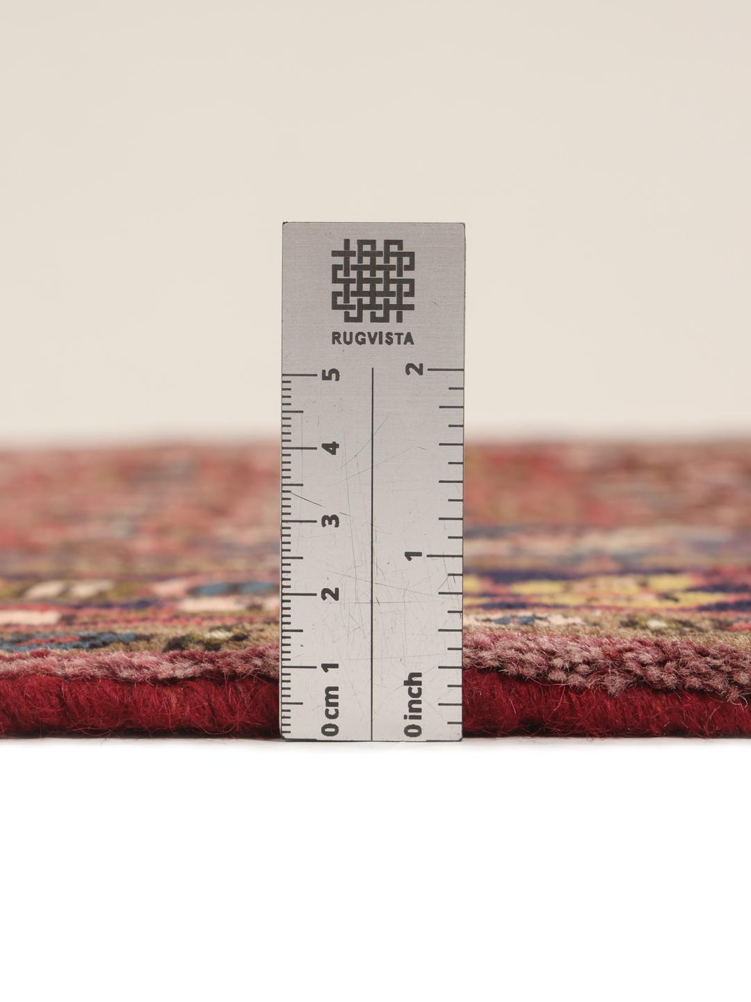 Hand-knotted Hosseinabad rug with a central medallion in red and blue tones