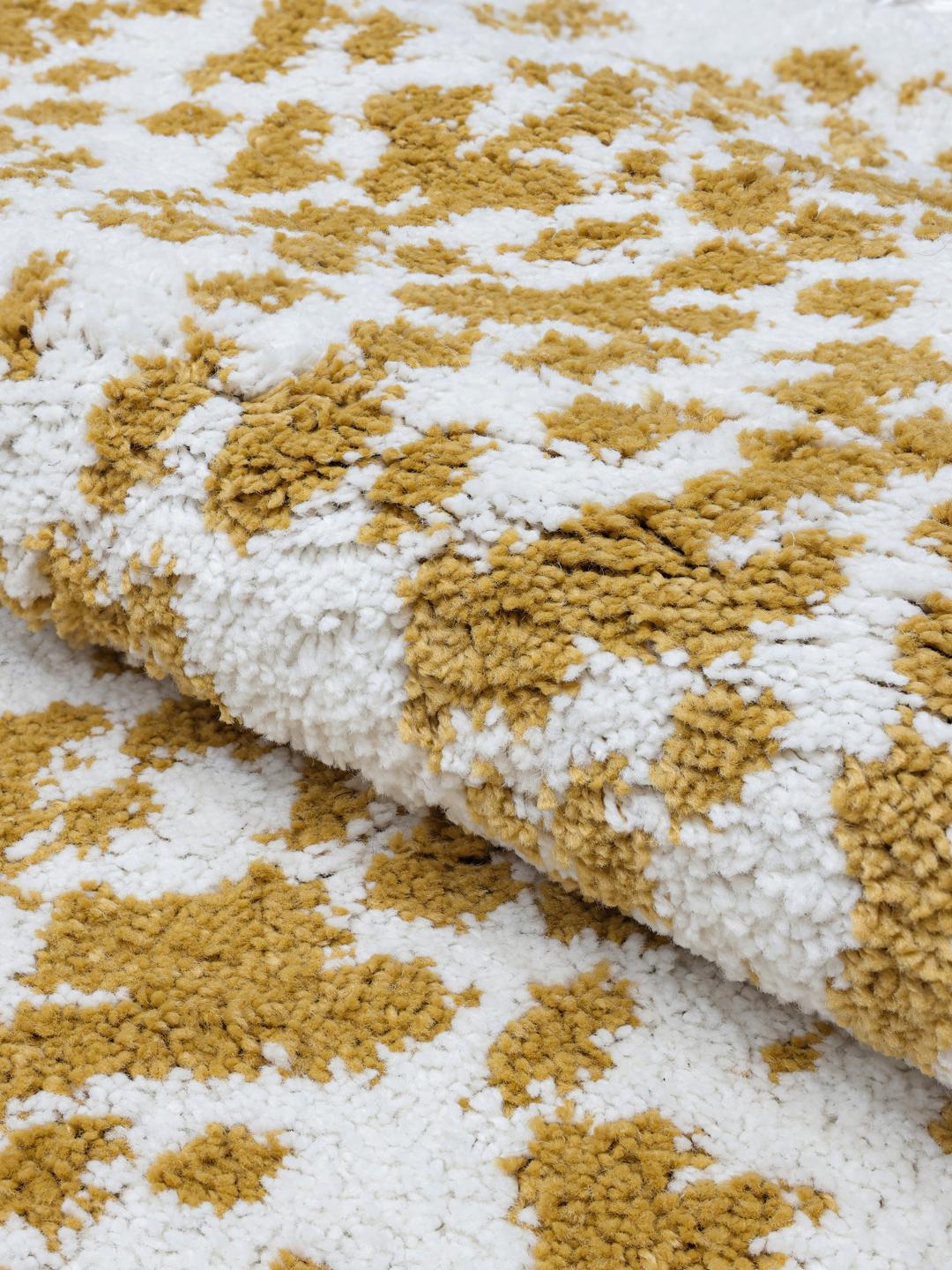 vloerkleed in mosterdgeel en wit