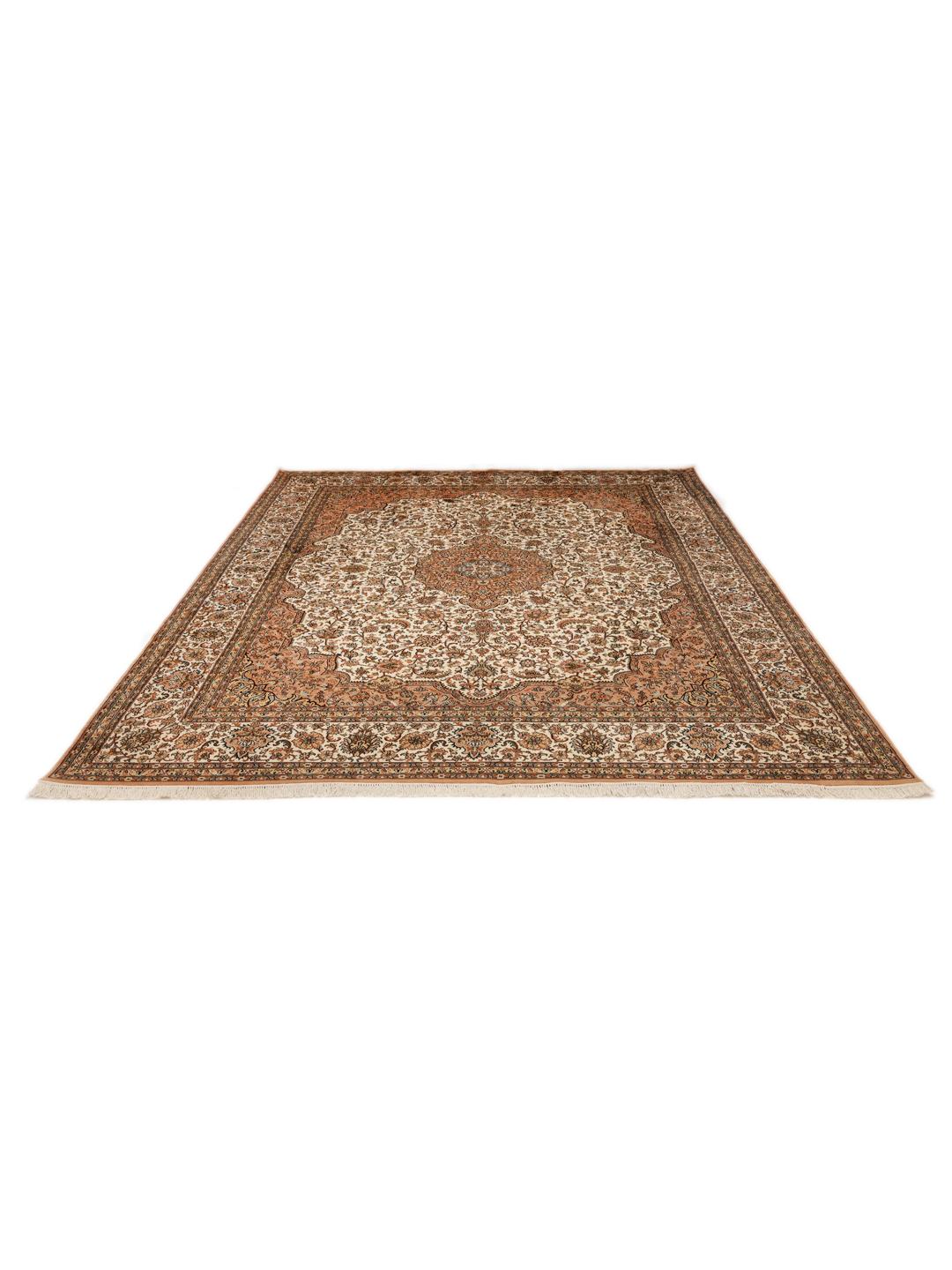 A hand-knotted Indian Kashmir silk rug with an intricate beige and floral pattern.