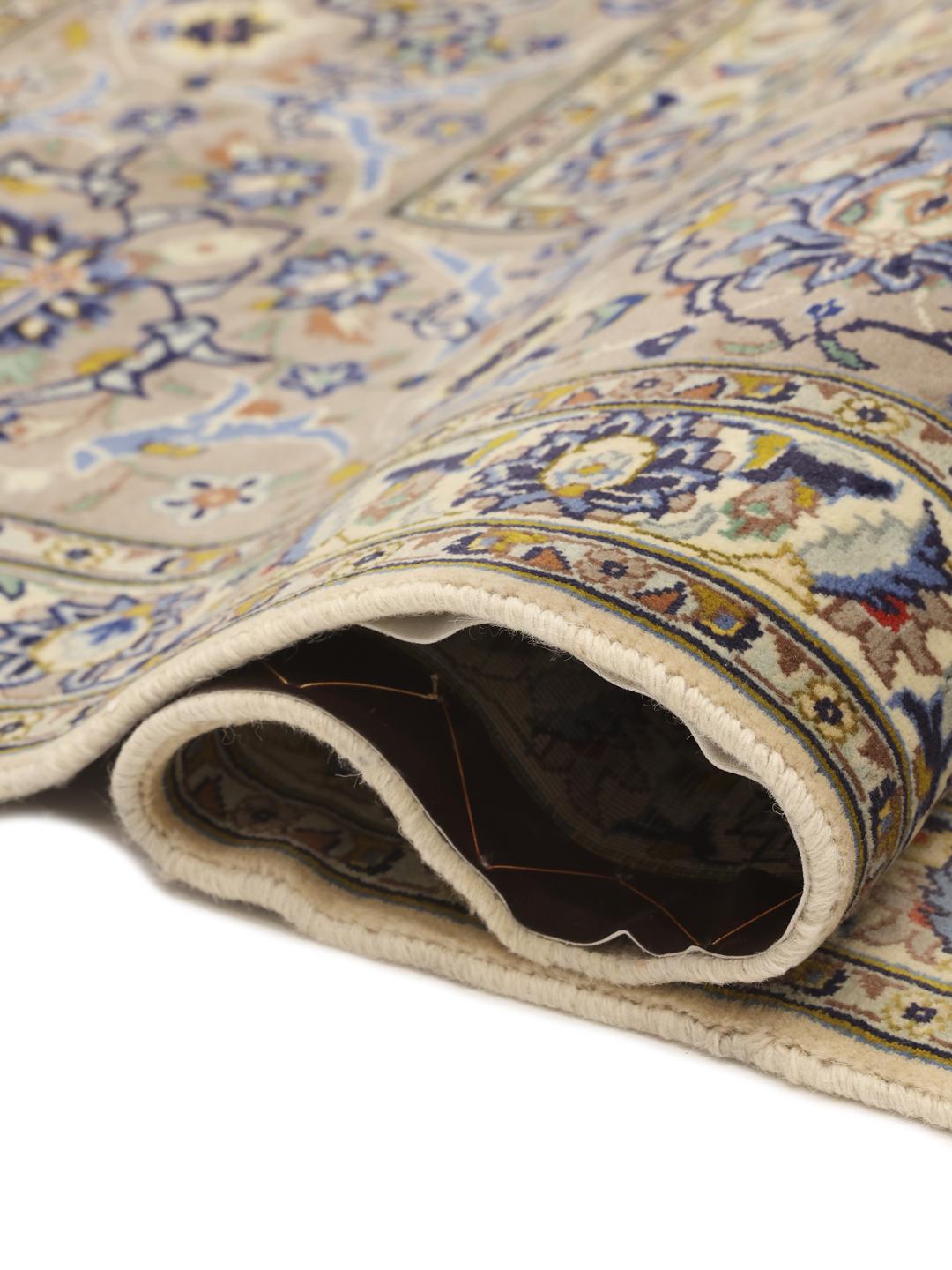 Hand-knotted Keshan rug from the Middle East with an ornate floral pattern in beige and blue tones