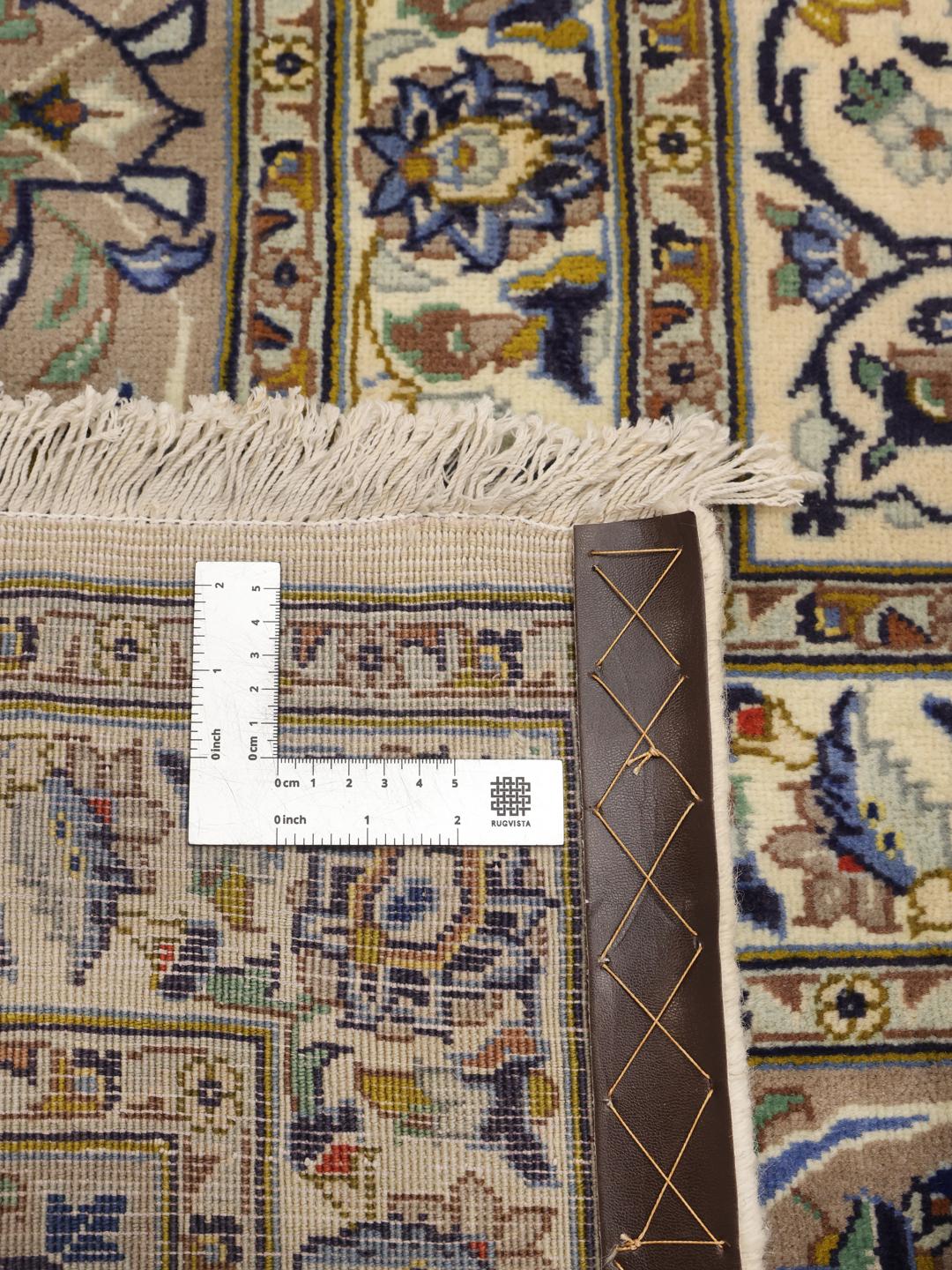 Hand-knotted Keshan rug from the Middle East with an ornate floral pattern in beige and blue tones