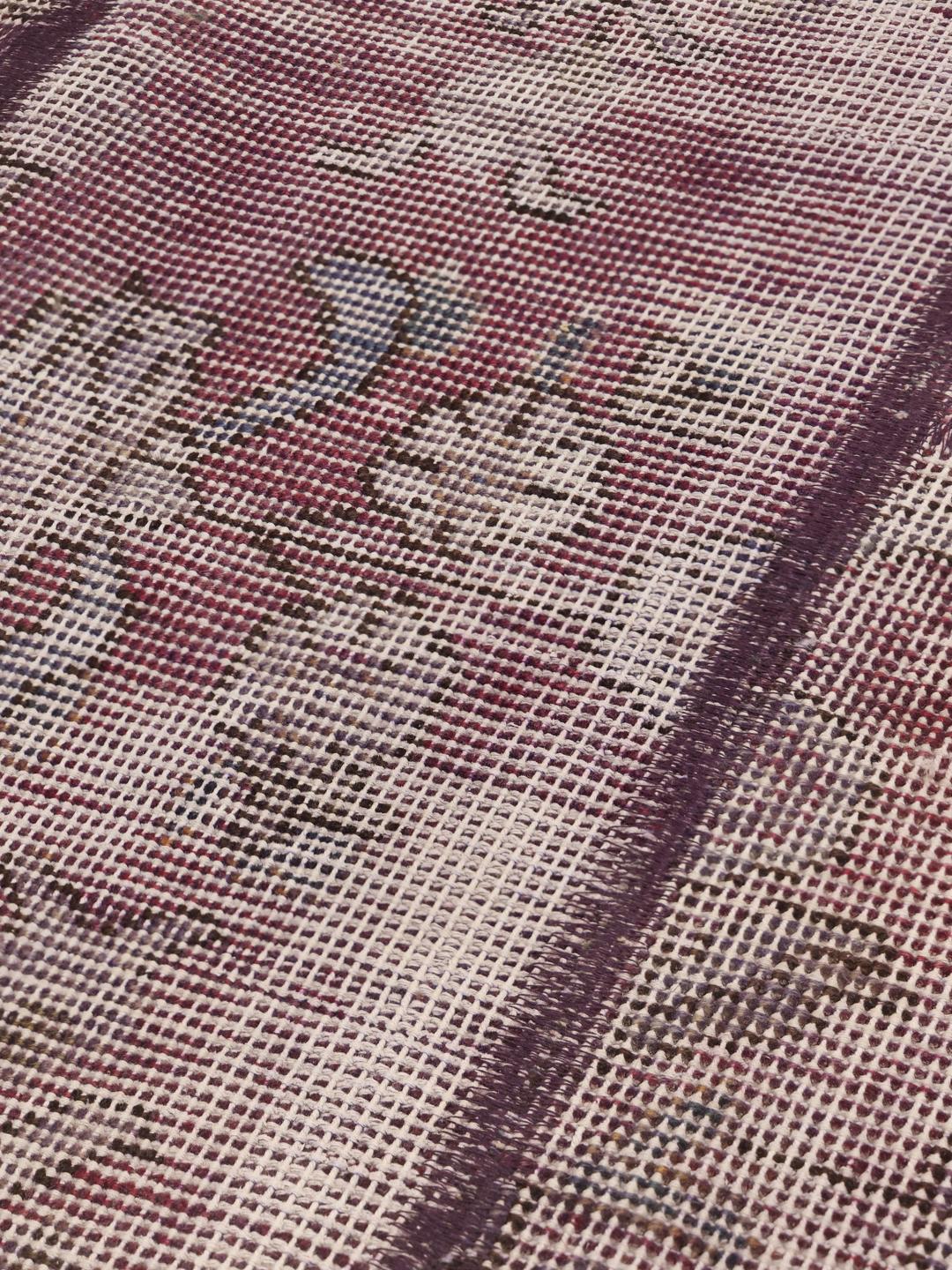 A unique, one-of-a-kind patchwork rug from the Middle East featuring a multicolor palette.