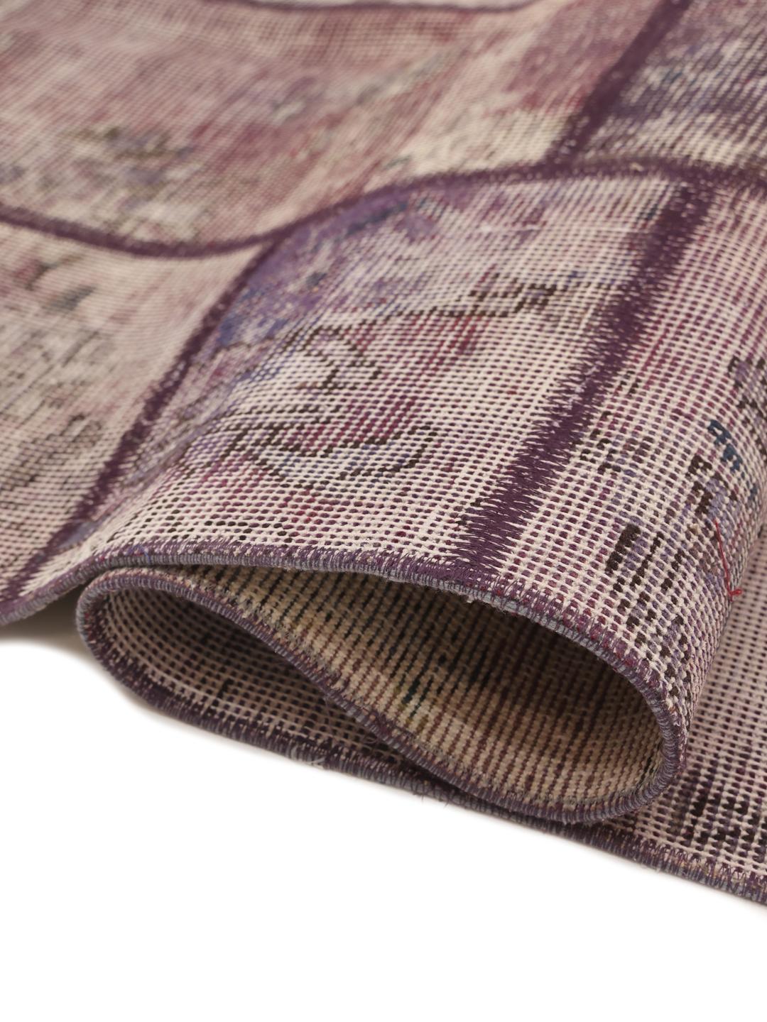 A unique, one-of-a-kind patchwork rug from the Middle East featuring a multicolor palette.