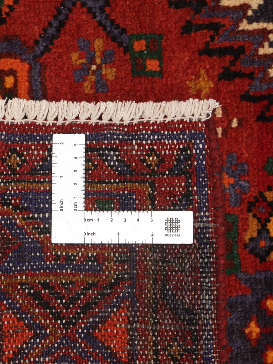 Handgeknoopt Zanjan-tapijt uit het Midden-Oosten in donkerrood met geometrische patronen