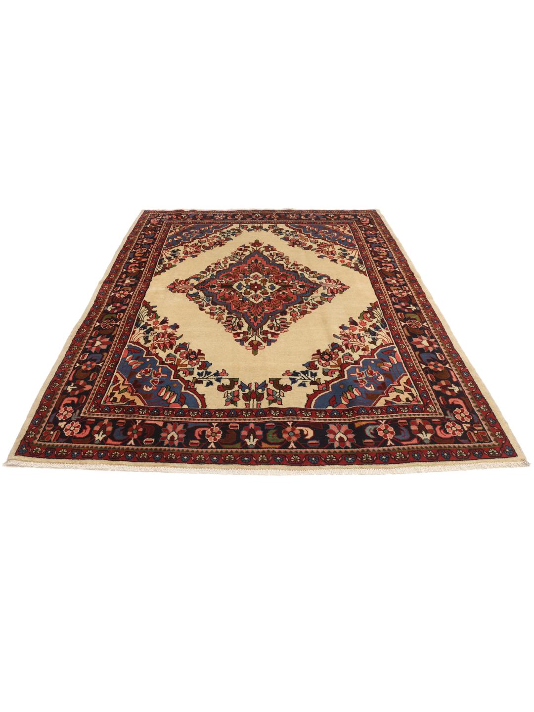 Handgemaakt Lillian-tapijt met een centraal medaillon en bloemmotieven in beige, blauwe en rode tinten