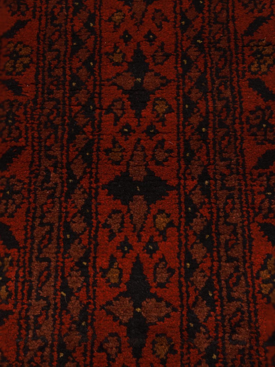 Hand-knotted Afghan Khal Mohammadi wool rug in dark-red with traditional patterns.