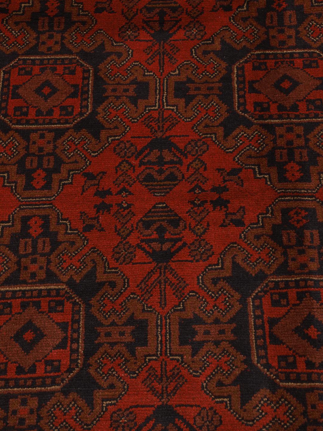 Hand-knotted Afghan Khal Mohammadi rug with a deep red field and geometric motifs