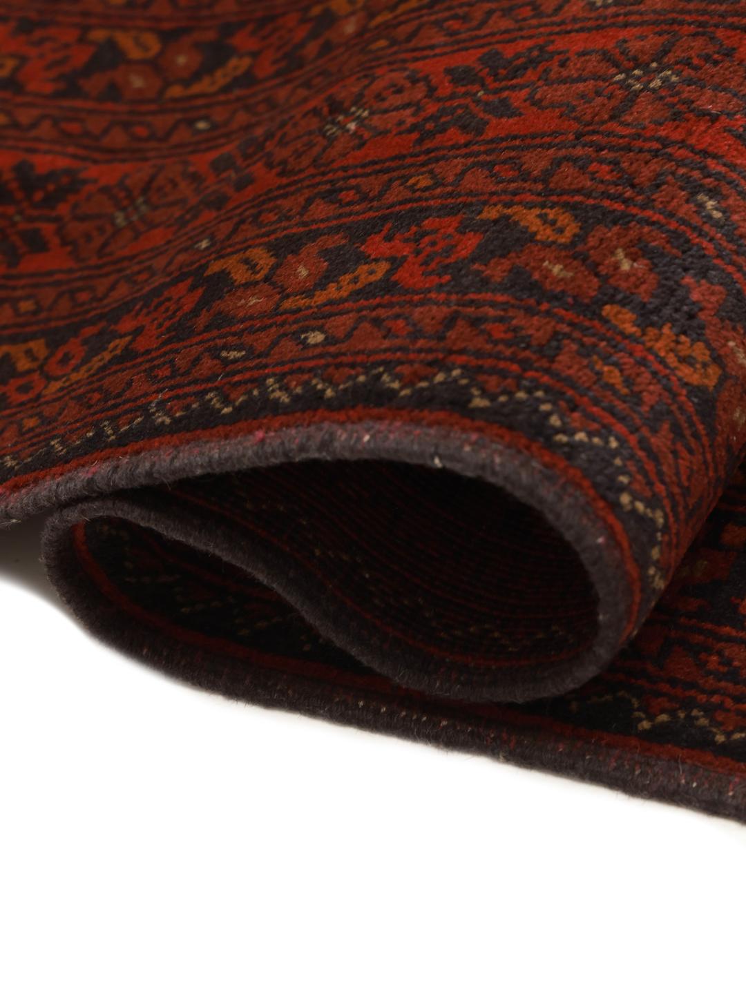Hand-knotted Afghan Khal Mohammadi rug with a deep red field and dark geometric motifs