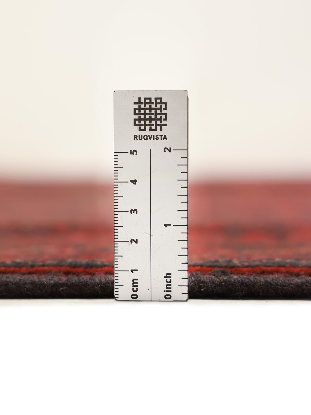 Hand-knotted Afghan Khal Mohammadi rug with a deep red field and dark geometric motifs