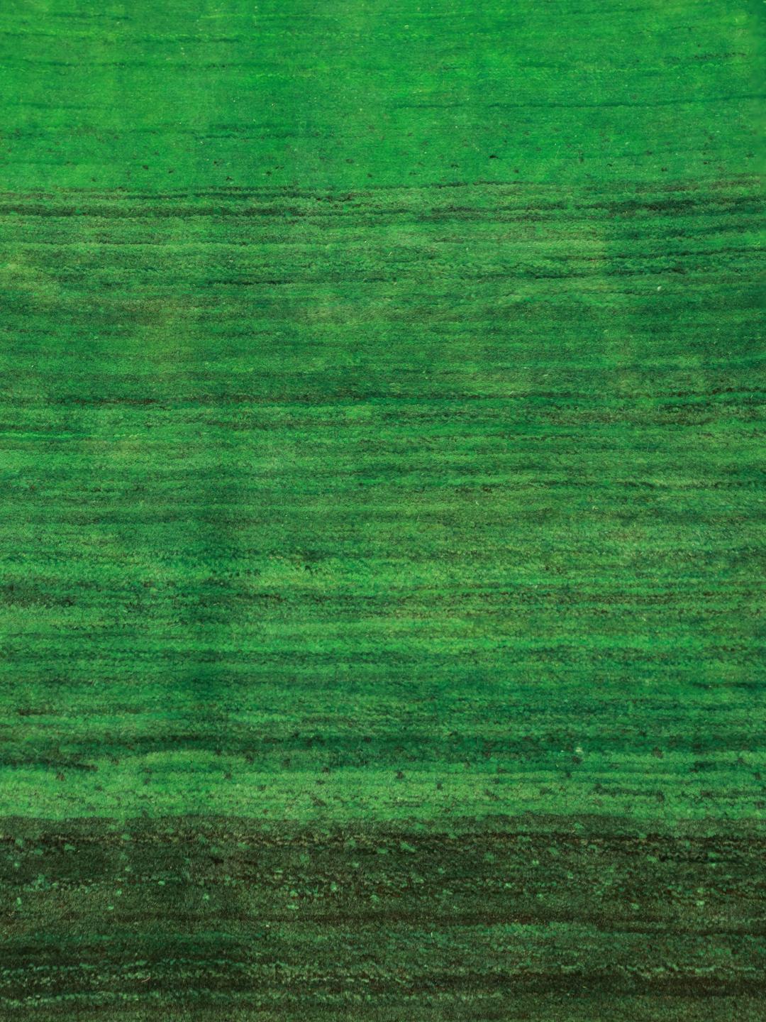 A hand-knotted green Gabbeh rug from the Middle East with a subtle ombre design.