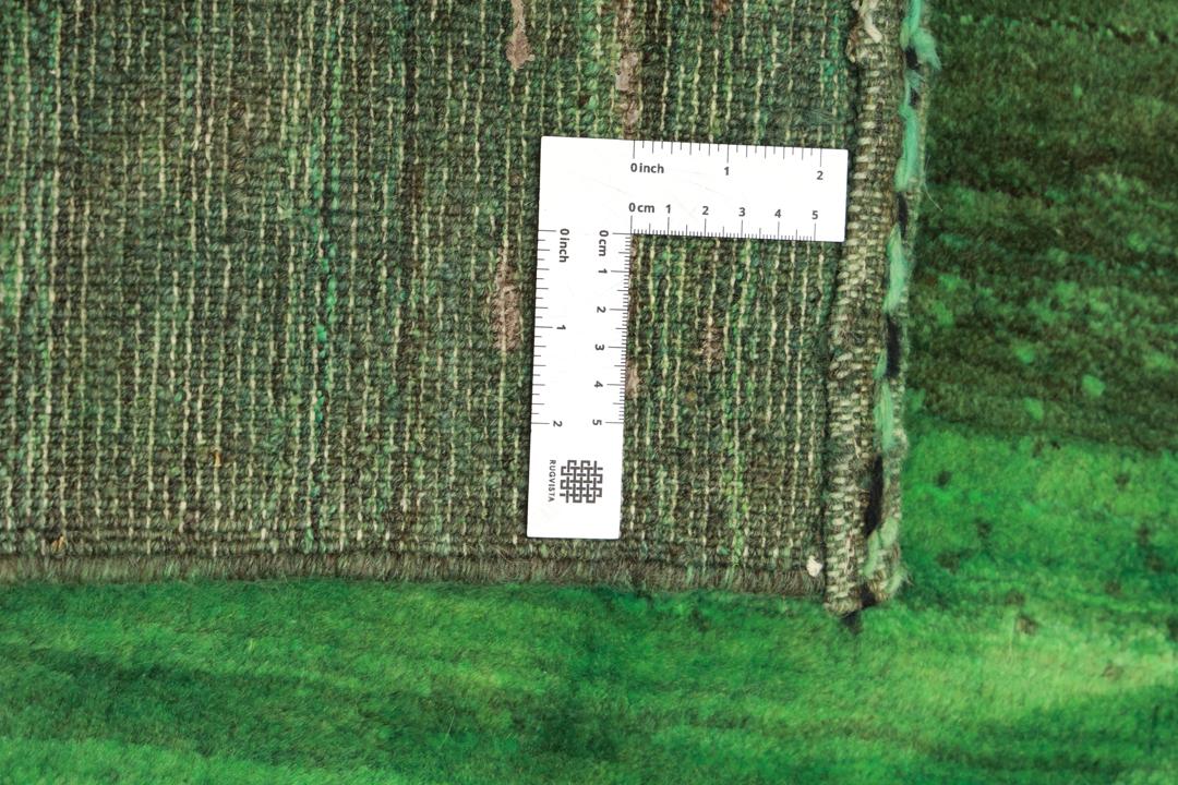 A hand-knotted green Gabbeh rug from the Middle East with a subtle ombre design.