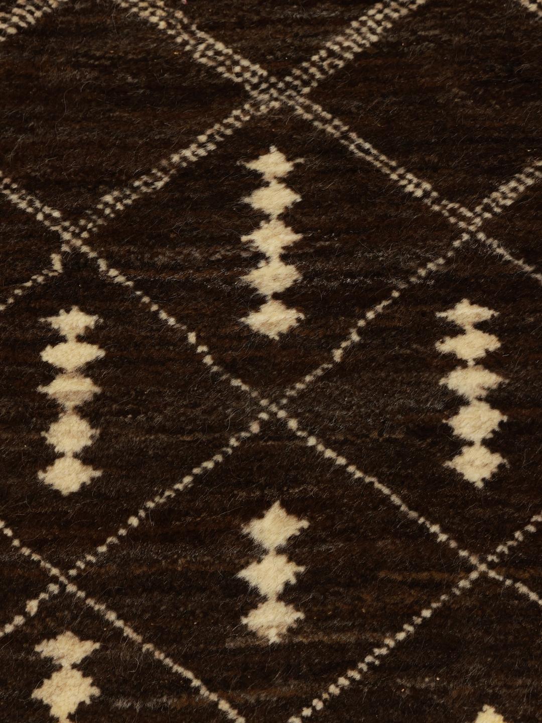 A hand-knotted brown wool rug with a geometric grid pattern from the Middle East.