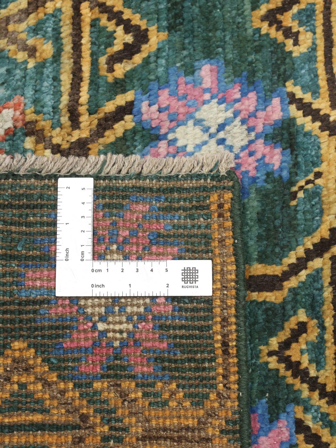 Håndknyttet afghansk løber med levende geometriske mønstre på en teal baggrund