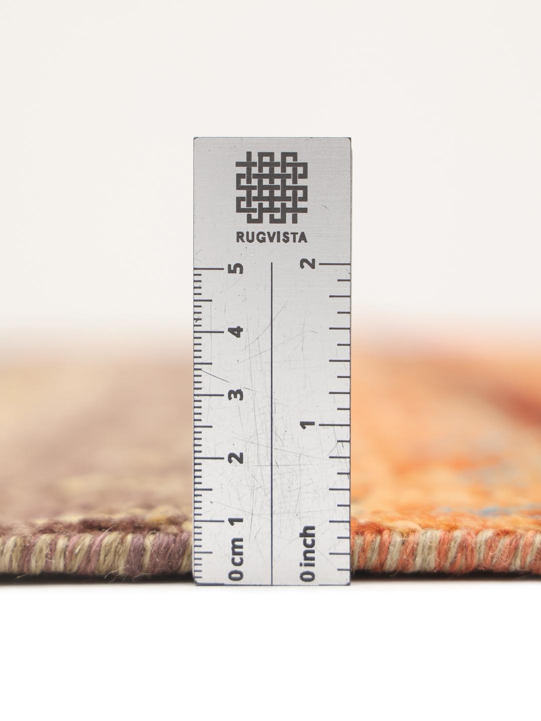 Handgeknoopt Afghaans tapijt met levendige geometrische patronen in veelkleurige wol.